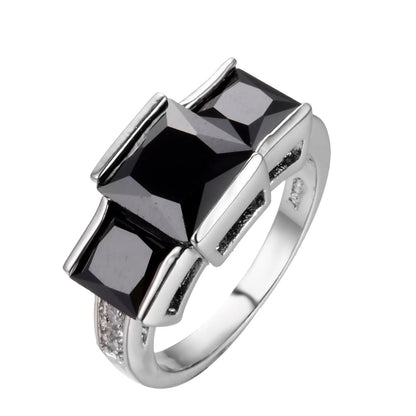 Aier Moxa geometric copper fashion ring in assorted electroplated colours on a plain background.