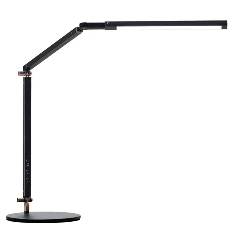 Adjustable aluminium desk lamp with remote control, shown in black with a clip attached to a desk edge.
