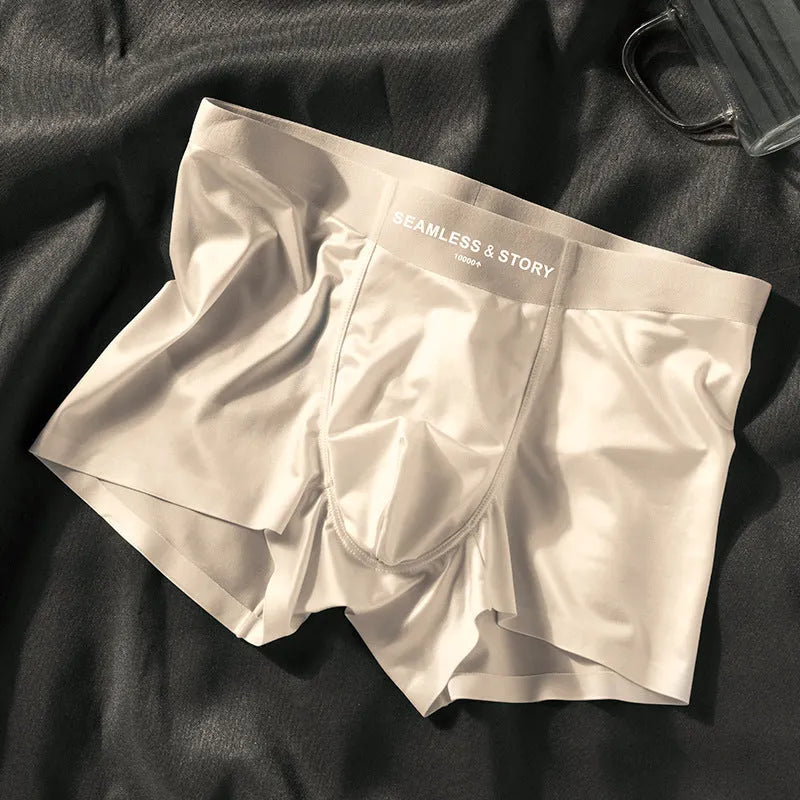 Men's solid colour satin ice silk boxer shorts laid flat, showing mid-waist design.