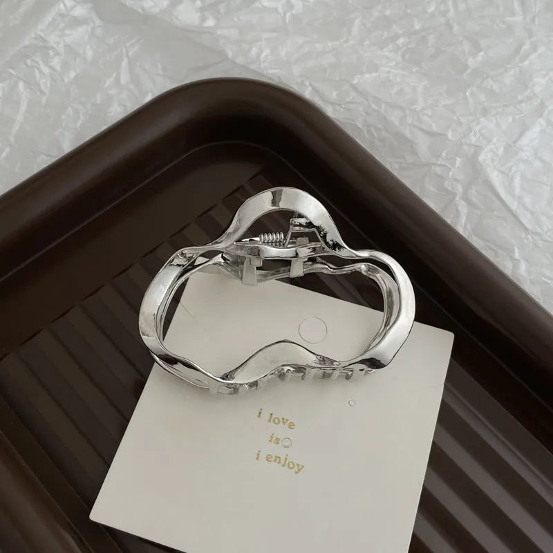 Silver metal hair claw barrette example from a range of 44 Korean-style designs.