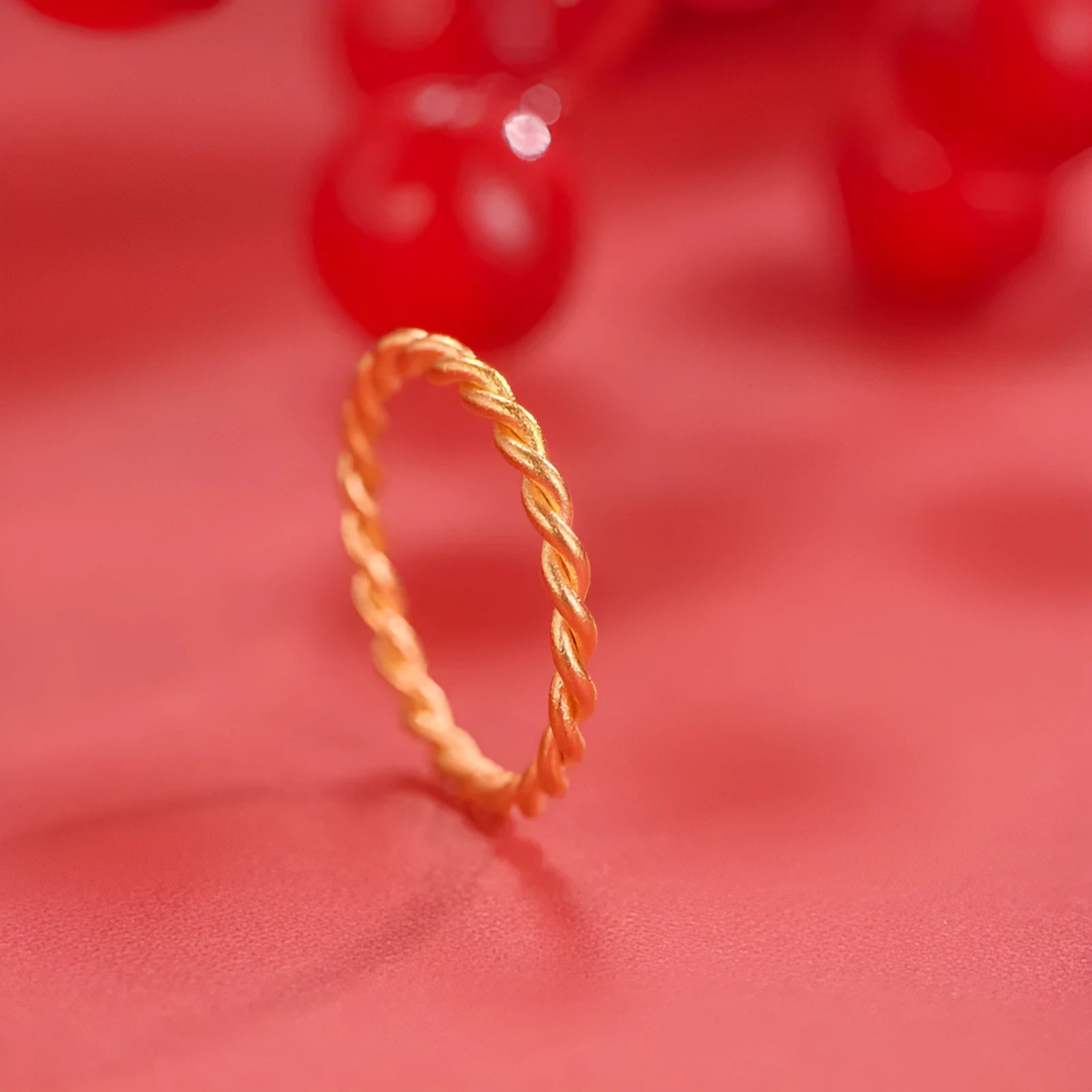 Gold-plated brass women's ring showing twist and simple bracelet styles in matte and glossy finishes.