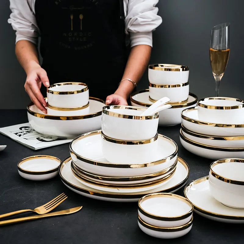 Platinum-coloured porcelain bowl and plate with gold rim, part of a wedding gift tableware set.