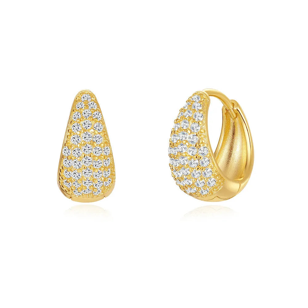 Pair of golden geometric clip-on earrings with a round design and screw-back mechanism on a white background.