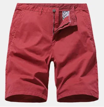 Man wearing blue denim loose-fit casual shorts with an elasticated waist, no belt.