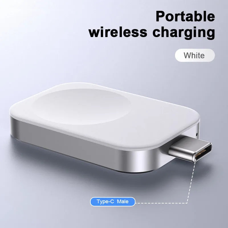 Compact black and white 3-in-1 magnetic wireless charger with integrated cables, shown next to a smartphone for scale.