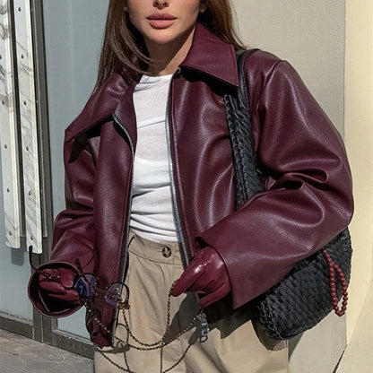 A stylish faux leather jacket with a zipper closure and lapel, available in burgundy and black colors.