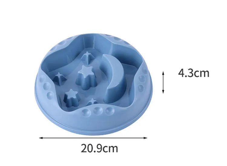 Blue slow feeder dog bowl with raised moon and star patterns inside, non-slip base