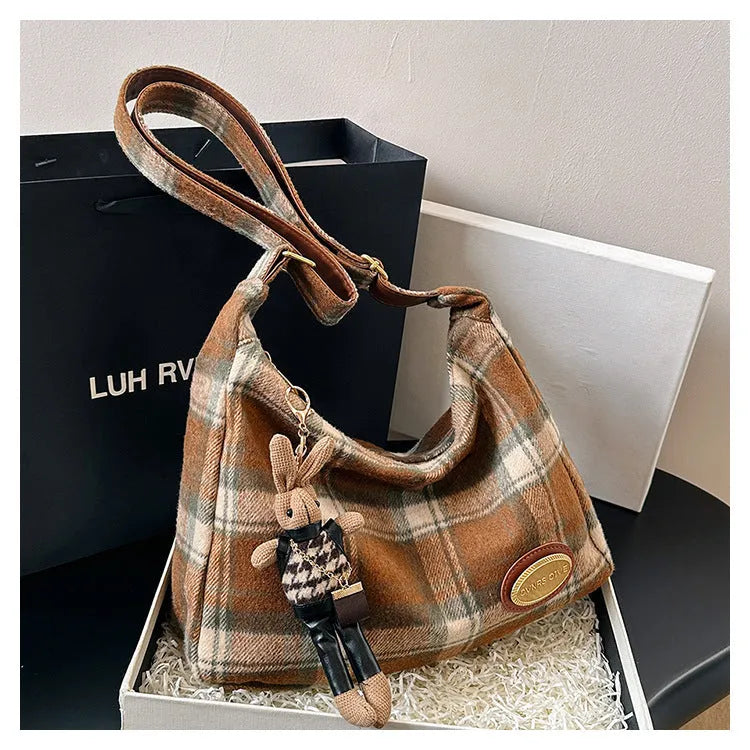 Women's large capacity woolen shoulder bag in brown with pendant attachment for autumn and winter use