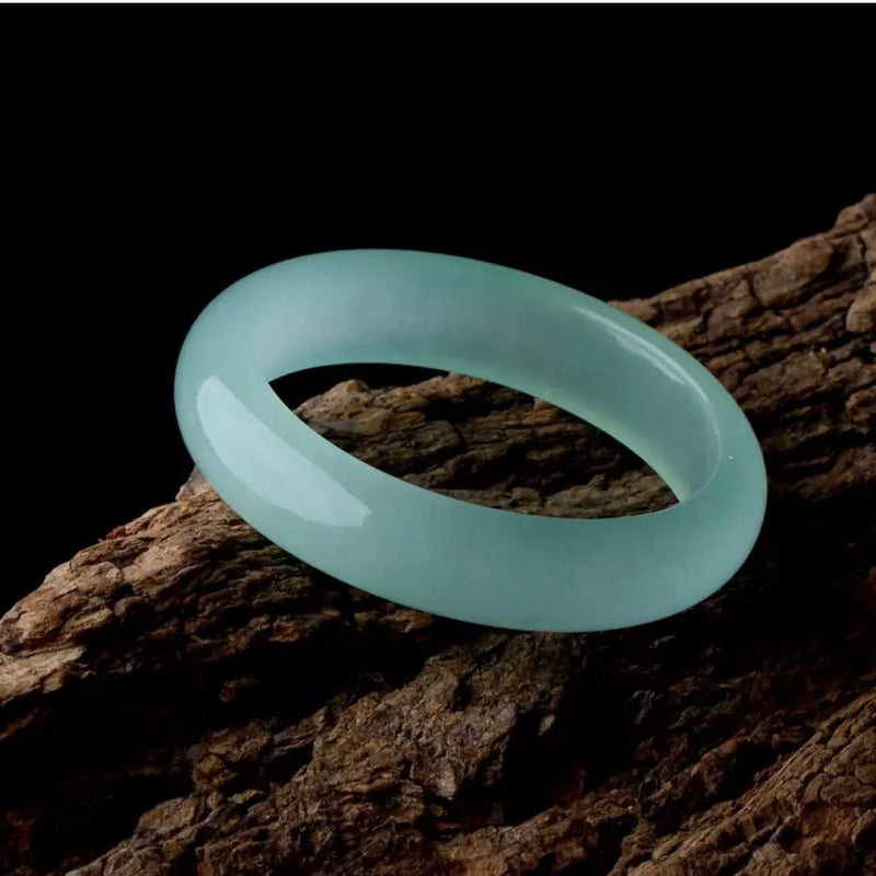 Jade bracelet for women made from quartz rock jade with modern simplicity styling available in blue or green colour with three size options from 56mm to 62mm inner diameter for adjustable wrist fitting
