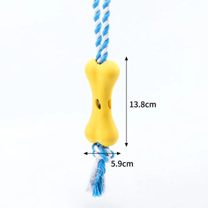 Green porous bone dog toy with knotted rope, hollow for treats, measuring 138mm