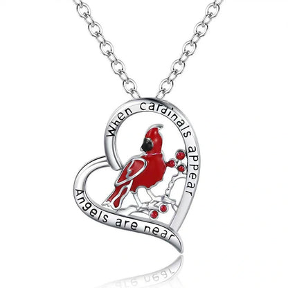 Elegant heart-shaped cardinal pendant necklace with a silver finish, perfect for gifting.