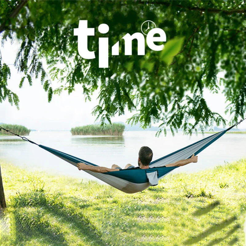 Premium double hammock made with soft, breathable fabric and reinforced ropes for outdoor use