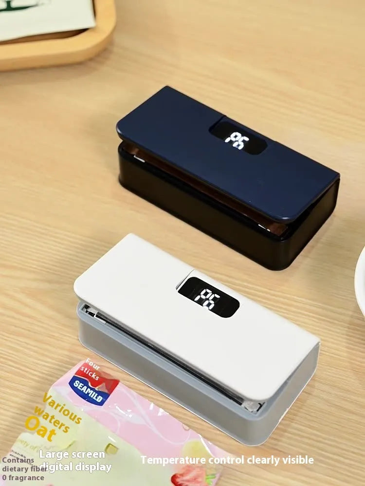 Small white portable mini sealing machine for heat sealing plastic snack bags measuring 4x3.5x14.4cm