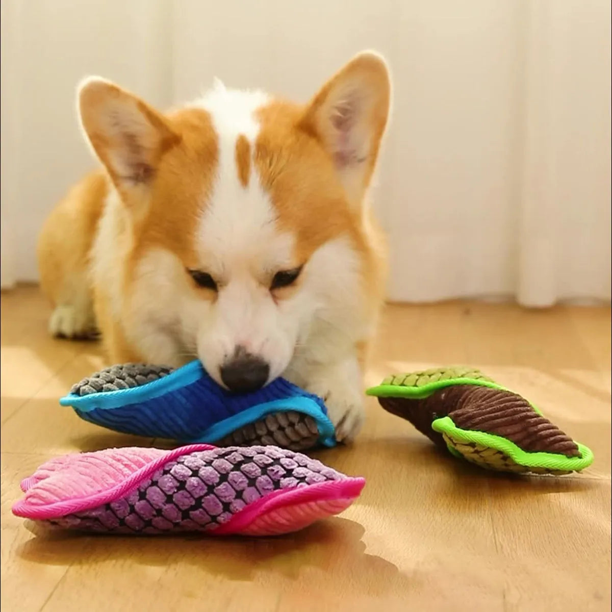 Blue plush teddy dog toy attached to a bone shape with corn fleece lining for bite-resistant chewing.