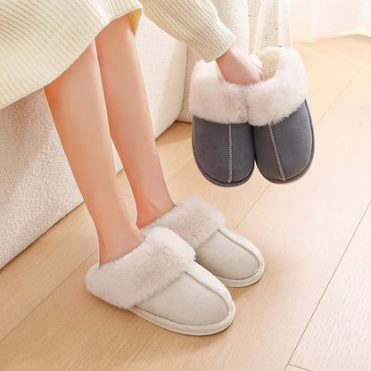 Women's plush winter slippers with round toe, flat heel, and stitching detail on a non-slip PVC sole.