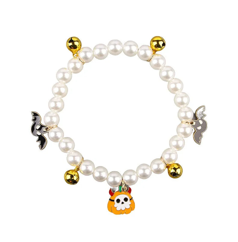 Three pearl necklaces with bells for pet Halloween costumes and decoration