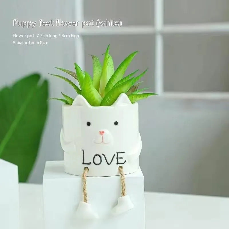 Ceramic hanging foot flowerpot with cartoon design for succulents on desktop