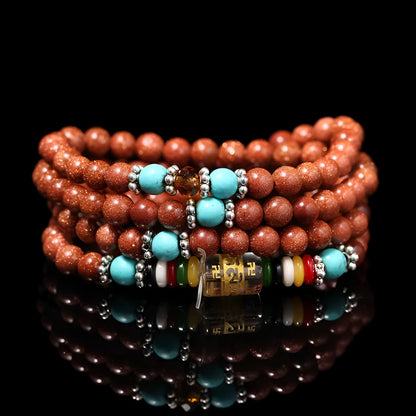 Women's golden star stone colour bracelet with 108 nugget sand pieces showing mantra text and fu character design