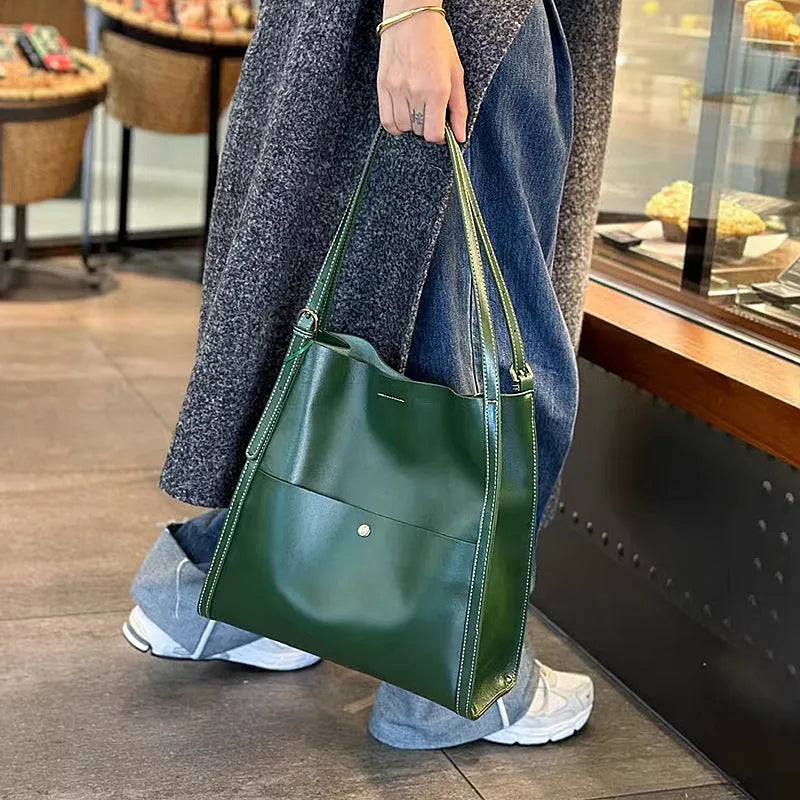 Large capacity women's tote bag in genuine first layer cowhide leather, soft square vertical shape with European and American retro style, includes multiple internal pockets for commuters