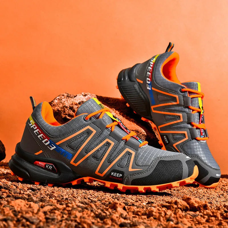 Men's low-top casual shoe in grey orange with synthetic leather upper and mesh lining.