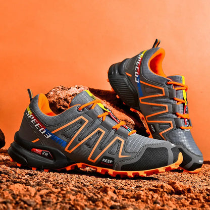 Men's low-top casual shoe in grey orange with synthetic leather upper and mesh lining.
