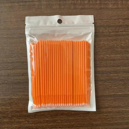 Disposable micro applicator brushes with coloured plastic handles and bendable cotton swab tips