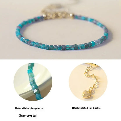 Women's blue apatite crystal bracelet with diamond-cut stones on wrist