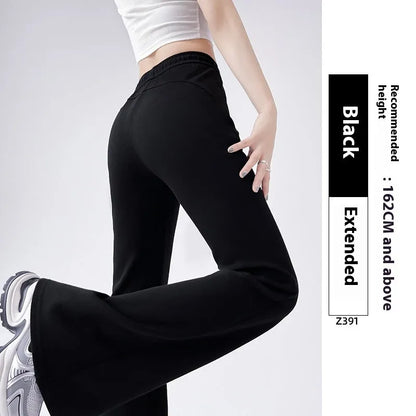 Women's high waist bootcut sports pants in black cotton with fleece lining and micro elasticity, slightly flared leg.