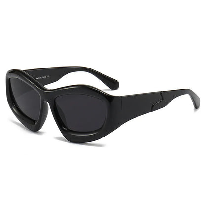 Outdoor unisex sunglasses with concave bubble lenses in black frame on a table.