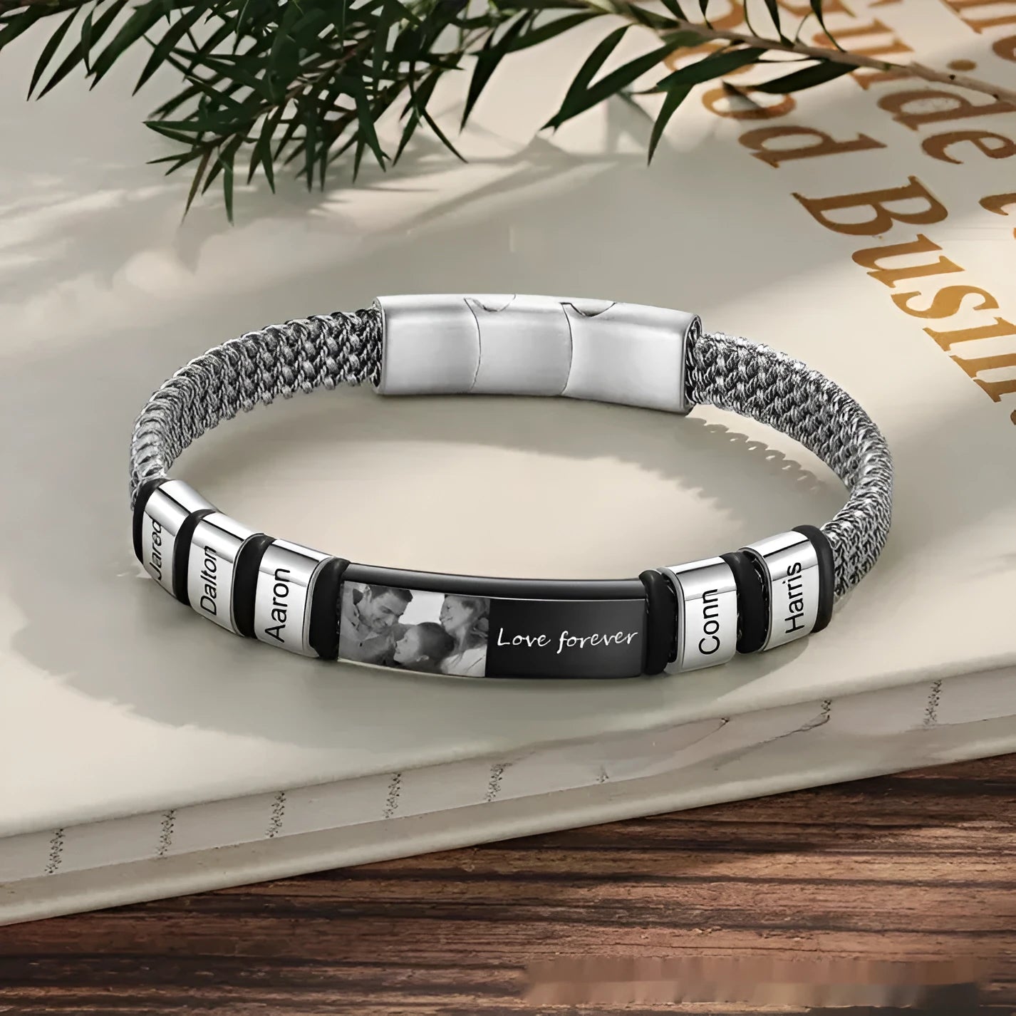 Stainless steel and leather rope bracelet with heart-shaped lettering beads on an adjustable band