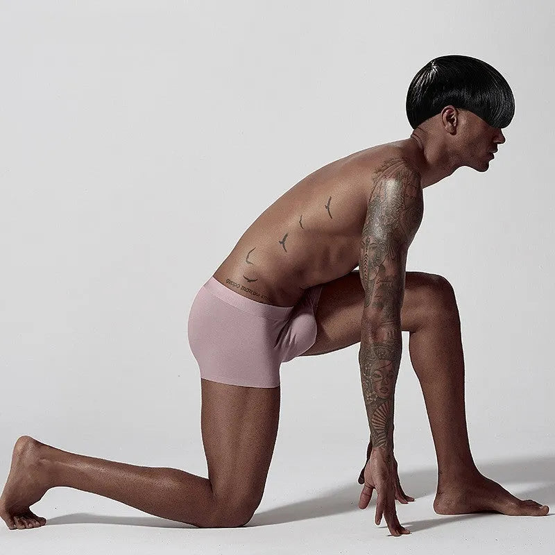 Men's solid colour seamless modal underwear in mid-waist style on a white background.