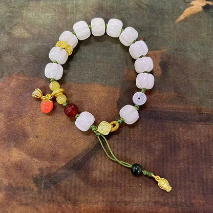 White jade Bodhi bracelet with lotus and pumpkin beads on open rope design