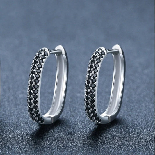 Pair of black zircon earrings with a U-shaped design, showcasing the elegant French-inspired style and high-quality copper construction.