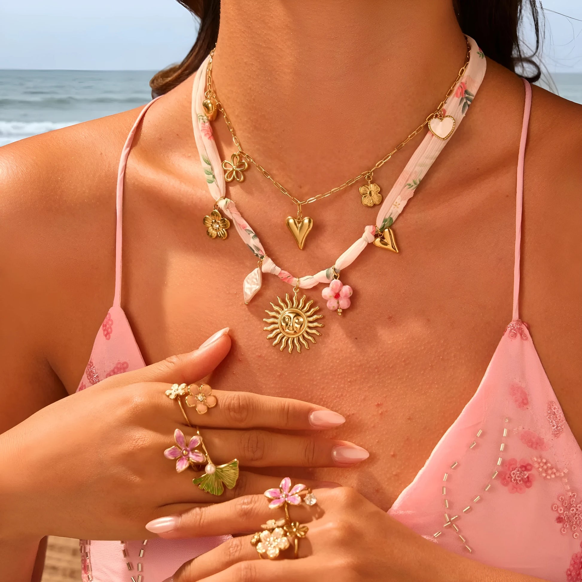 Stainless steel necklace with a geometric sun pendant on an adjustable chain.