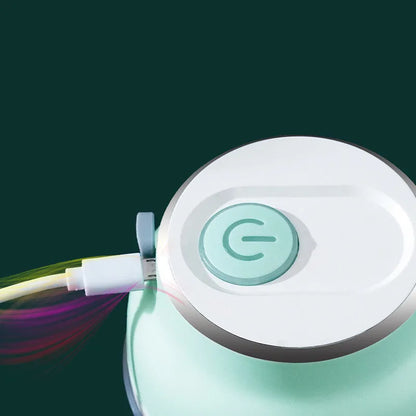 Green portable electric garlic chopper with transparent cup and USB charging cable