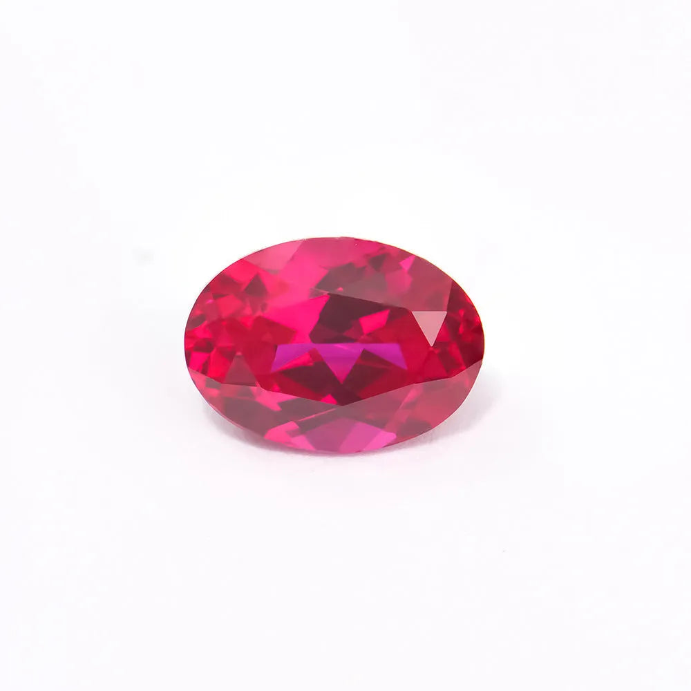 Synthetic pigeon blood red ruby gemstone showing egg shape, round, and princess square cuts