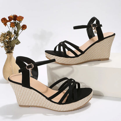 Women's black wedge sandals with a fish mouth toe bracket and fabric upper.