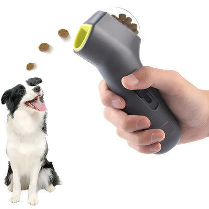 Grey-coloured pet treat catapult launcher for dogs and cats on a plain background.
