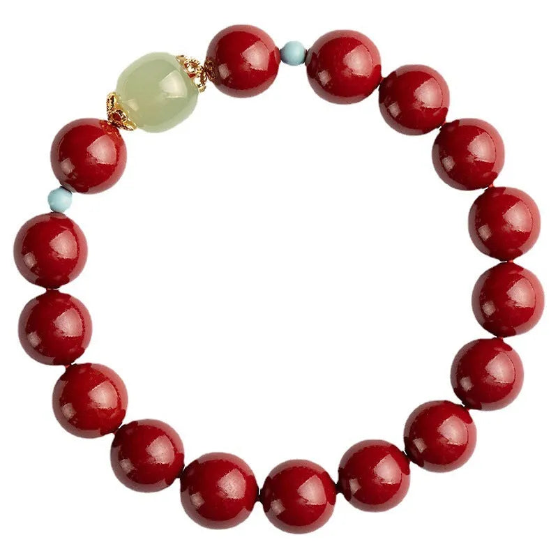 Purple Gold Sand cinnabar bracelet with geometric ellipse beads and a metal clasp on a wrist.