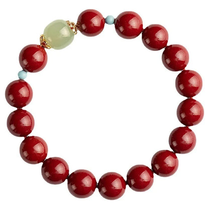 Purple Gold Sand cinnabar bracelet with geometric ellipse beads and a metal clasp on a wrist.