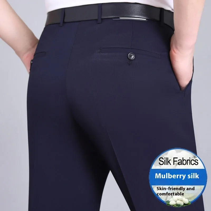 Man wearing dark blue straight-leg non-iron business trousers with a mulberry silk blend fabric.