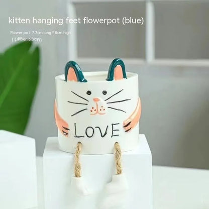 Ceramic hanging foot flowerpot with cartoon design for succulents on desktop