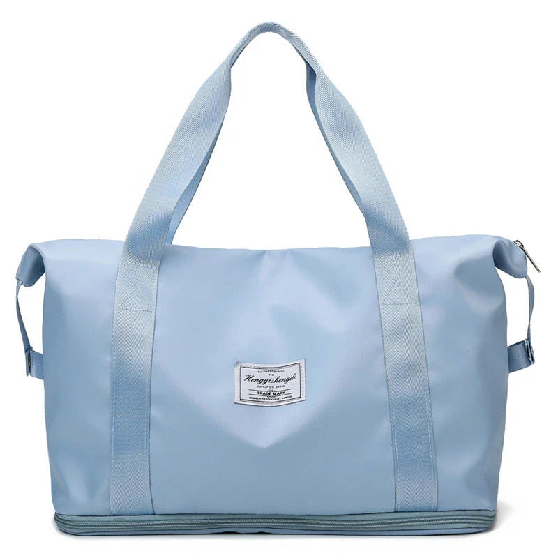 Spacious gym travel bag in various colors, featuring multiple pockets and comfortable carrying handles for workout, yoga, and outdoor use.