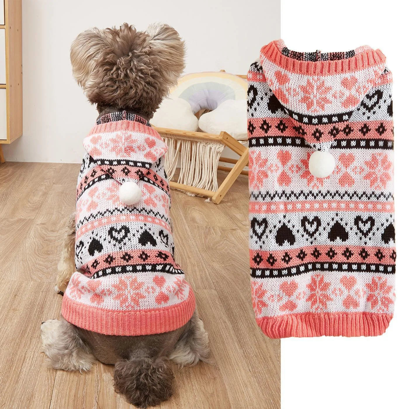 Small dog wearing a pink camouflage patterned knitted sweater with snowflake and heart stripes.