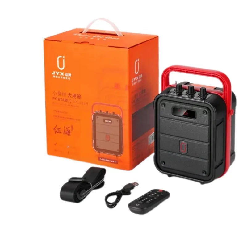 MS62AI portable Bluetooth speaker with wireless microphone on a table, showing control knobs and strap.