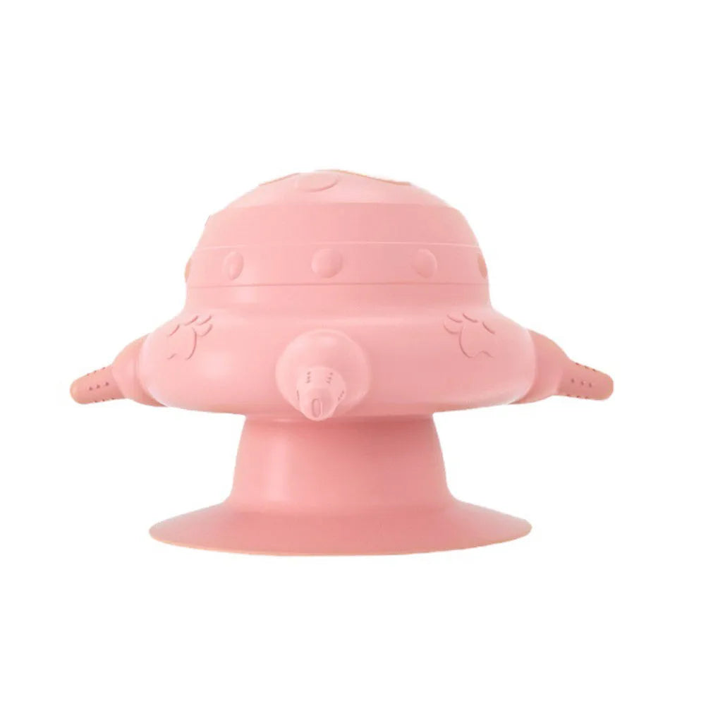 Pink silicone pet nursing bottle with bionic breast design and four pacifiers on a flat base.