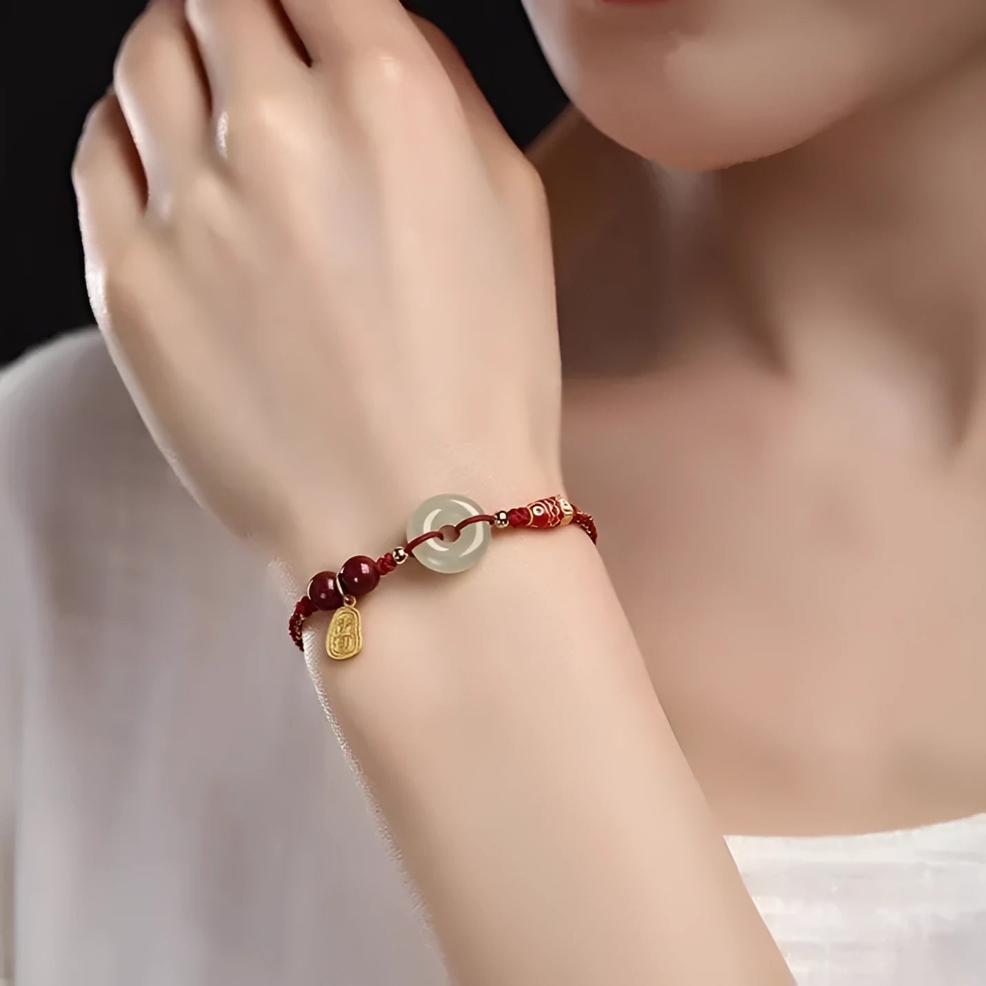 Hetian jade peace buckle bracelet with 10mm beads on red braided rope