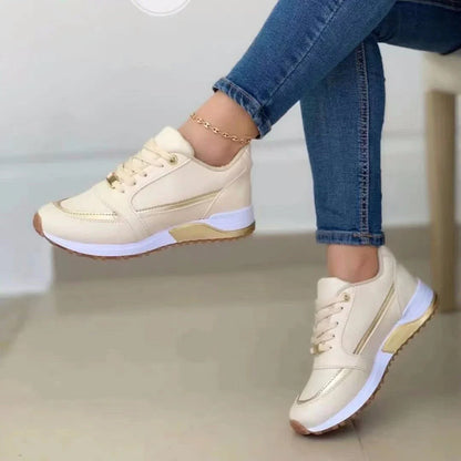 Stylish lace-up sneakers with synthetic leather upper, round toe, and rubber sole for comfortable everyday wear