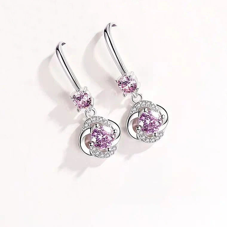 Silver stud earrings with four-leaf clover design and fairy ear hooks