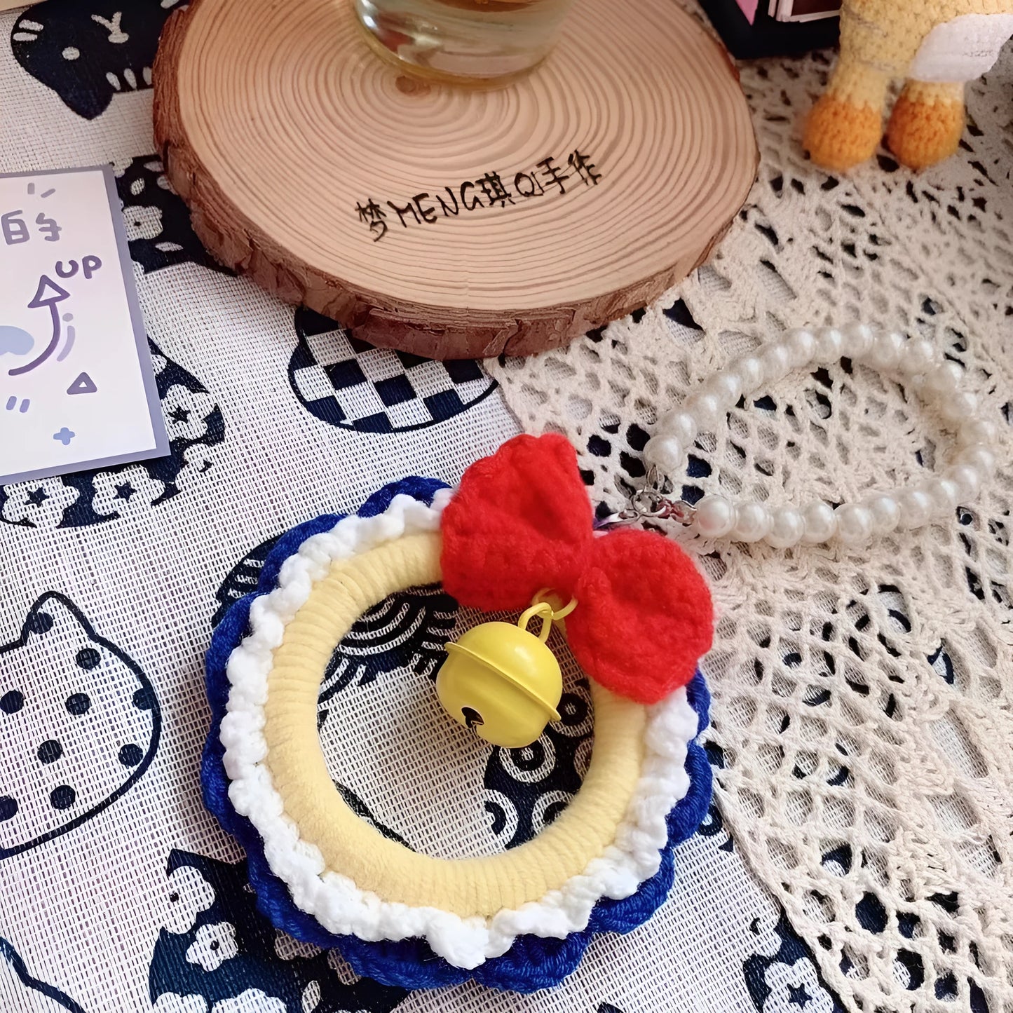 Handmade Snow White plush yarn car hanging ornament, shown as a pendant, with option for red wind chimes.